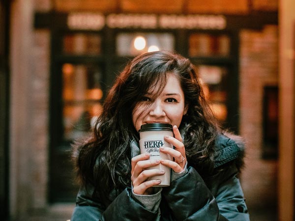 woman holding a cup of coffee